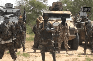 Cette Saisie D’écran Tirée D’une Vidéo De Propagande De Boki Haram Montre Son Chef, Abubakar Shekau, Entouré De Combattants Du Groupe Terrorriste Islamiste.
